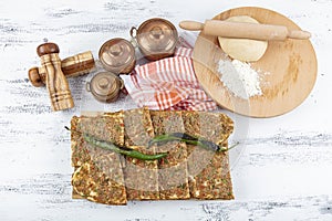 Turkish and Arabic Traditional Sliced Etli Ekmek Pide or Lahmacun serving on wood background