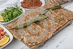 Turkish and Arabic Traditional Sliced Etli Ekmek Pide or Lahmacun serving on wood background