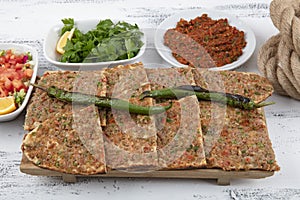 Turkish and Arabic Traditional Sliced Etli Ekmek Pide or Lahmacun serving on wood background