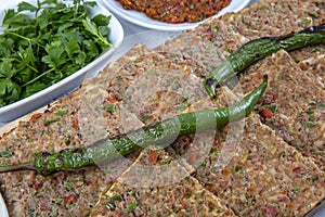 Turkish and Arabic Traditional Sliced Etli Ekmek Pide or Lahmacun serving on wood background