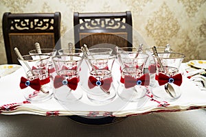 Turkish Azeri traditional pear-shaped glass for black tea. Armudu Armud at the bottom and a glass bowl on the table