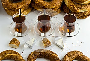 Turkish Bagel,`Simit` and tea on white surface with creamy cheese