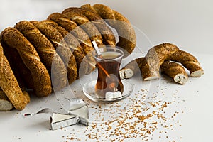 Turkish Bagel,`Simit` and tea on white surface with creamy cheese