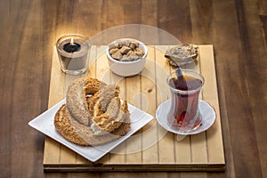 Turkish bagel, simit with Turkish tea on wood table