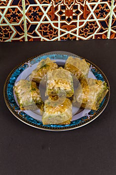 Plate piled with Baclava, elevated, portrait photo