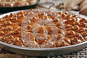 Turkish Baklava in a Round Metal Tray on Vintage Traditional Tablecloth