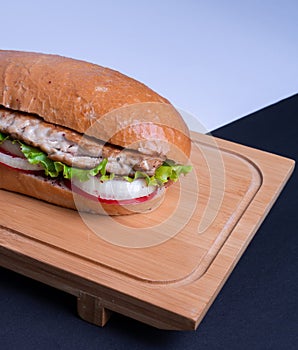 Turkish Balik Ekmek or Fish sandwich. Closeup of a catfish fillet sandwich