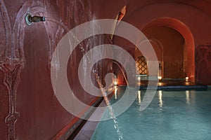 Turkish baths with vaporous blue salt water, oil lamps, water jets photo