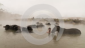 Turkish boy and his horse in thermal water, Guroymak, Bitlis