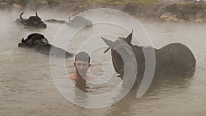 Turkish boy and his horse in thermal water, Guroymak, Bitlis