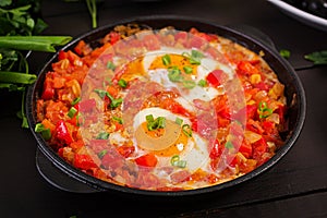 Turkish Breakfast - shakshuka, olives, cheese and fruit.