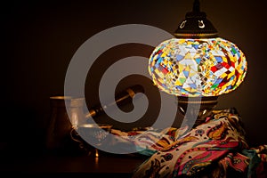 Turkish cafe illuminated by Turkish lamp and silk scarf photo