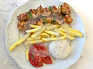 Turkish Chicken Shish Kebab with Rice Pilav or Pilaf Potatoes and Tomato / Sis Kebap. photo