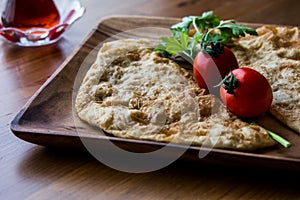 Turkish Cig Borek / Tatar Pie with minced meat and tea.