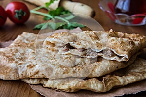 Turkish Cig Borek / Tatar Pie with minced meat and tea.