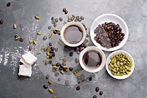 Turkish Coffee with coffee beans and Cardamom scattered on a vintage background