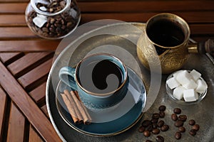 Turkish coffee. Freshly brewed beverage served on wooden table