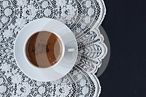 Turkish coffee on a lace and black background