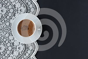 Turkish coffee on a lace and black background