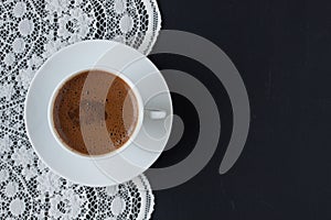 Turkish coffee on a lace and black background