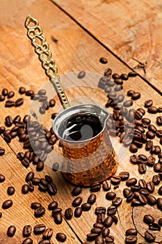 Turkish coffee maker on a rustic wooden table