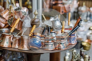 Turkish coffee pots, also know as ibrik, cezve, and briki in a street maket photo