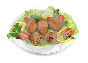 Turkish cuisine, bulgur coated meatballs ( icli kofte ) photo