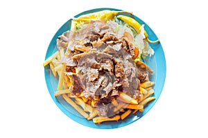 Turkish cuisine. Doner kebab meat with pommes frites potatoes and salad on plate isolated on white background