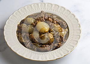 From Turkish cuisine Onion stew with entrecote. Turkish name Antrikotlu yogan guvec or yahni