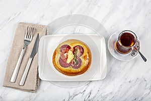 Turkish cuisine Sausage Mini Pizza. Puff pastry mini pizza with tomato, pepper and sausages
