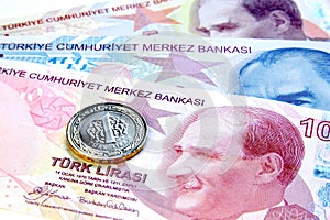 Turkish currency 1 TL coin over paper bills
