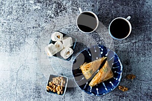 Turkish delight. Baklava and coconut lukum with cups of coffee