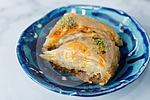 Turkish delight. Baklava and coconut lukum with cups of coffee photo