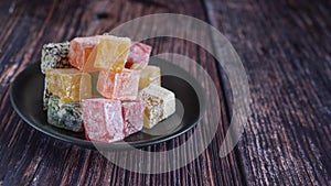 Turkish delight on a dark wood background