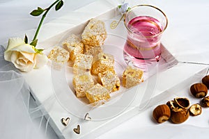 Turkish delight dessert with hazelnut and rose tea
