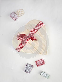 Turkish delight with a heart shaped gift box tied with a red an