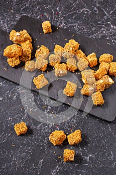 Turkish delight with nuts on dark stone background