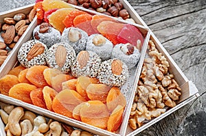 Turkish delight oriental sweets dried fruits and nuts in a wooden box. Background. Healthy vegan food. Natural food. Selective