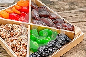 Turkish delight oriental sweets dried fruits and nuts in a wooden box. Background. Healthy vegan food. Natural food. Selective