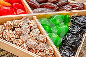 Turkish delight oriental sweets dried fruits and nuts in a wooden box. Background. Healthy vegan food. Natural food. Selective