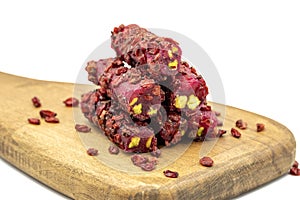 Turkish Delight Pistachio Pomegranate Fingers with Barberries isolated on a white background. Close-up pistachio Turkish delight.