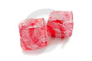Turkish delight. Rose rahat locum, two pieces of sweet oriental delights in powered sugar. Close-up view
