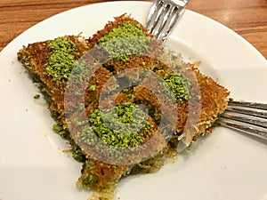 Turkish Dessert Kadayif with pistachio powder traditional dessert