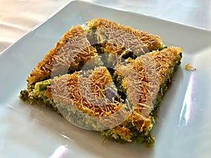 Turkish Dessert Kadayif with pistachio powder traditional dessert
