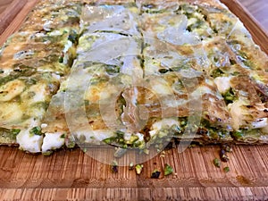 Turkish Dessert Katmer with Pistachio Powder from Gaziantep Region / Prepared with Crispy Thin Dough and Clotted Cream Cheese