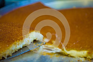 Turkish dessert kunefe, kunafa, kadayif with pistachio powder an