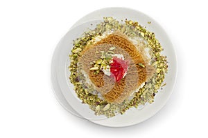 Turkish dessert kunefe, kunafa, kadayif with pistachio powder and cheese