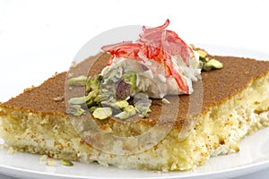Turkish dessert kunefe, kunafa, kadayif with pistachio powder and cheese photo