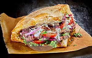 Turkish doner kebab on golden toasted pita bread