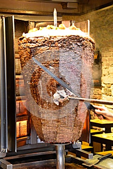 Turkish doner kebap they cut with a big knife